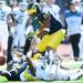 Michigan junior quarterback Denard Robinson loses hold of the ball as teammate sophomore wide receiver Jeremy Gallon looks on tight during the first half against Eastern Michigan at Michigan Stadium on Saturday. Melanie Maxwell I AnnArbor.com